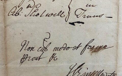 A close up of a handwritten letter in cursive.