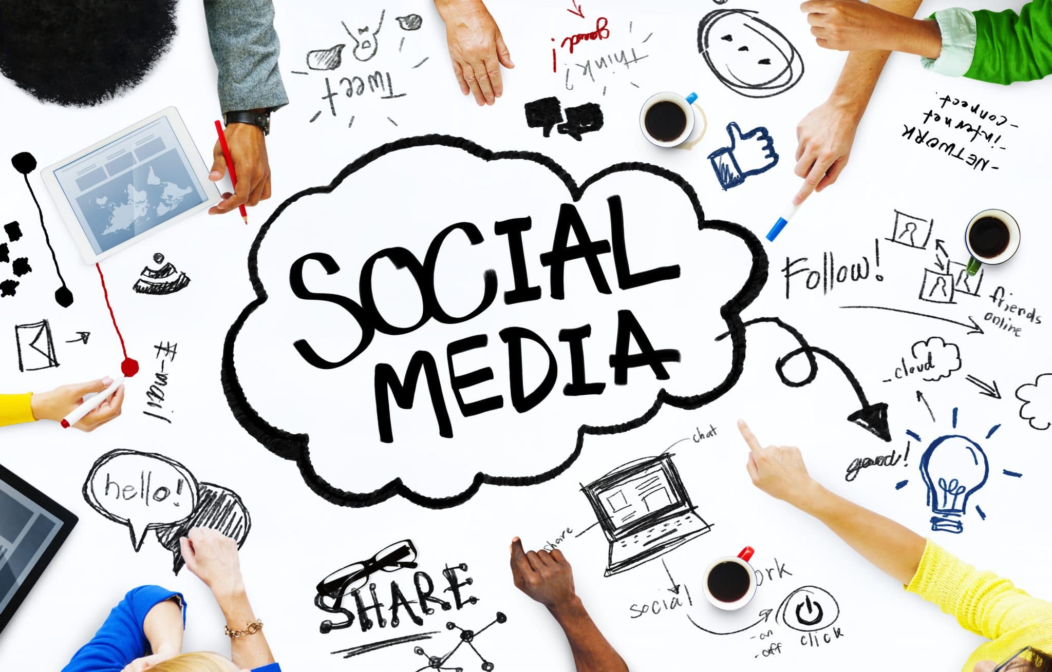 Social Media in center written in a word bubble with hands reaching out to touch drawings of laptops, ipads, and cellphones.
