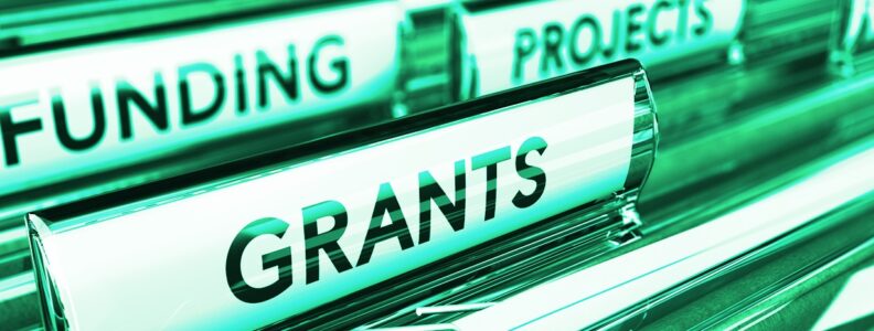 File markers that read Funding and Grants.